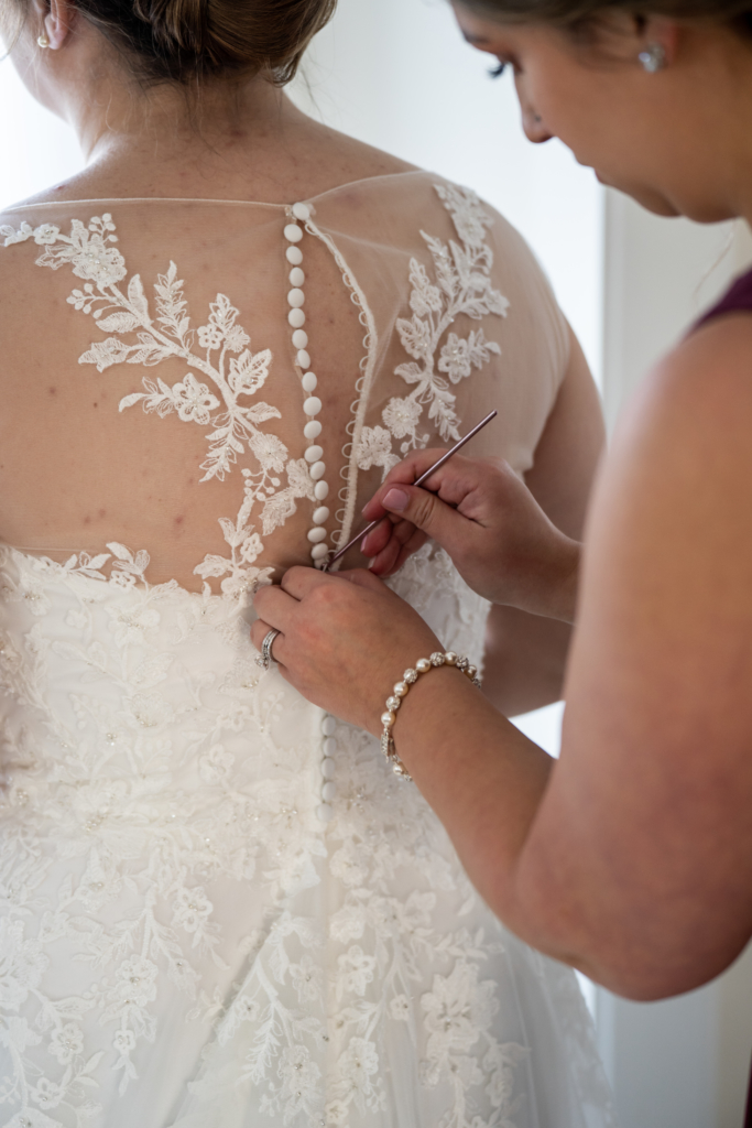 using crochet needle to button wedding dress
